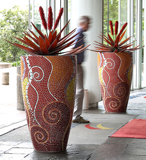 Mosaic planters with decorative bead aloes