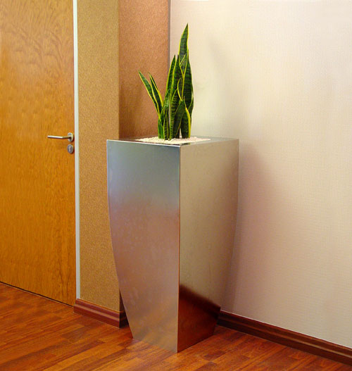 Stainless steel planter in corporate office.